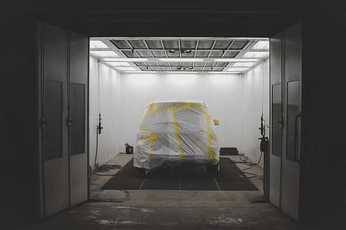tent vehicle covered by white in garrage boston
